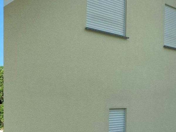Hausfassade in Münster nach der Fassadenreinigung, Algen und Grünbelag entfernt